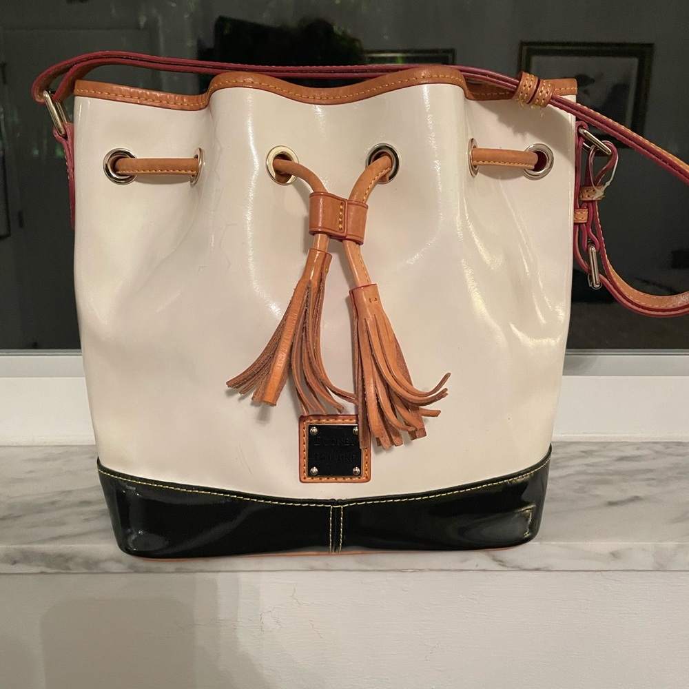 Dooney Bourne - patten leather white bucket bag  black and beige trimming